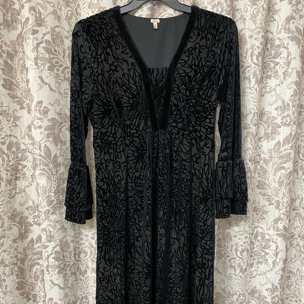 Black velour scroll pattern on black dress